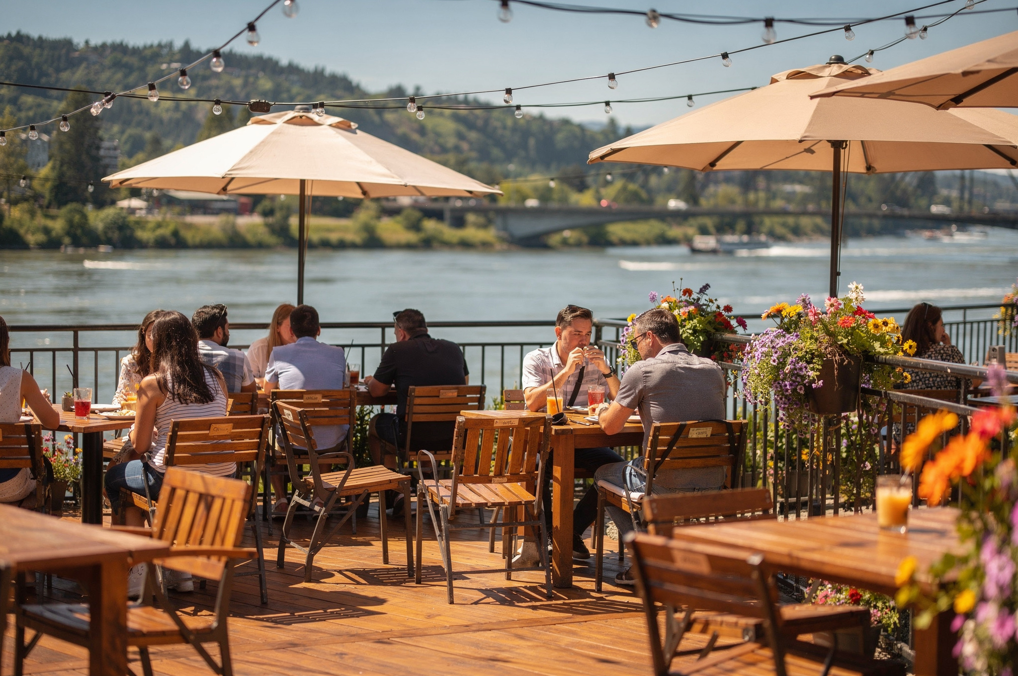 Outdoor riverside restaurant patio dining in New Westminster with waterfront view